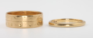 Two 22ct gold wedding bands size J and M, 7 grams