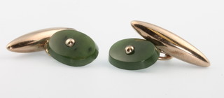 A pair of yellow gold and jade cufflinks 