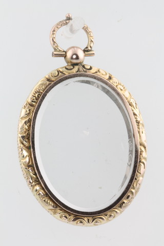 A 9ct yellow gold double sided oval locket 