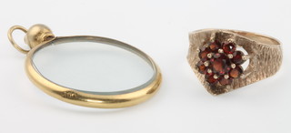A 9ct yellow gold gem set ring size K and a circular locket