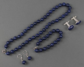 A lapis lazuli bead necklace, earrings and bracelet and a pair of ditto cufflinks