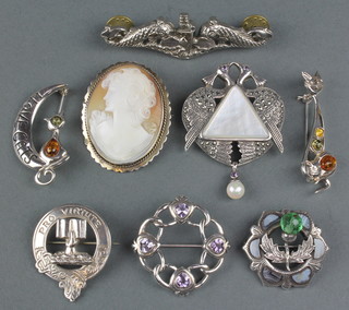 A silver cameo brooch and  7 others