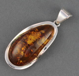 A silver mounted amber pendant