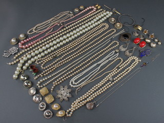 A collection of silver costume jewellery and imitation pearl necklaces 