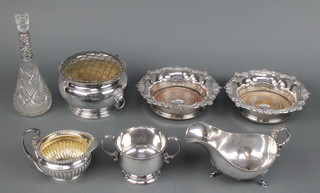 A silver mounted toilet bottle 9", a pair of Sheffield plate coasters, a sauceboat and 3 other items 