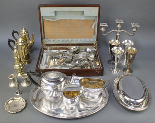 An oval silver plated salver, a canteen of minor cutlery and a quantity of plated ware 