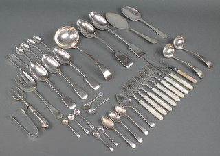 A silver plated gravy spoon and minor plated cutlery 