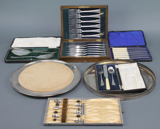 A silver plated mounted bread board, minor cased sets 