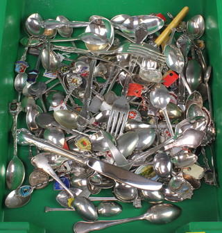 A collection of plated souvenir spoons