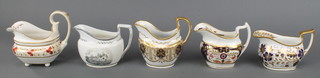A 19th Century Derby cream jug with floral and gilt decoration,  a Minton style ditto with blue and gilt floral decoration, a Spode pattern ditto and a Spode transfer print ditto 