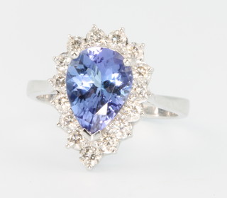 An 18ct white gold pear cut tanzanite and diamond ring, the centre stone approx 1.93ct surrounded by brilliant cut diamonds approx. 0.69ct size L 1/2