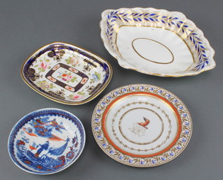 A Caughley enhanced fisherman saucer 5 1/2", a New Hall style plate with armorial 7 1/2", a Ridgway teapot stand with spring flowers and blue and gilt decoration and a Derby dish 11" 
