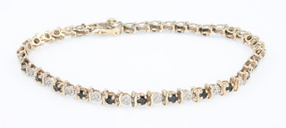 A 9ct yellow gold gem set line bracelet 6.7 grams