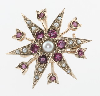 A 15ct yellow gold seed pearl and ruby star brooch 