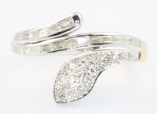 A 14ct yellow and white gold snake ring set with brilliant and baguette cut diamonds size R 1/2