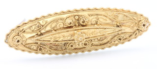 An Edwardian 15ct yellow gold etruscan oval brooch, 6 grams