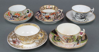 A New Hall style bute shaped tea cup and saucer, a Derby Imari pattern ditto, a New Hall transfer print ditto with rural buildings, a Spode Felspar ditto with armorial and a man on the bridge pattern ditto 