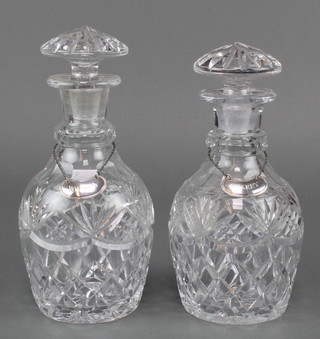 A pair of mallet shaped decanters with mushroom stoppers having silver spirit labels - whisky and sherry 
