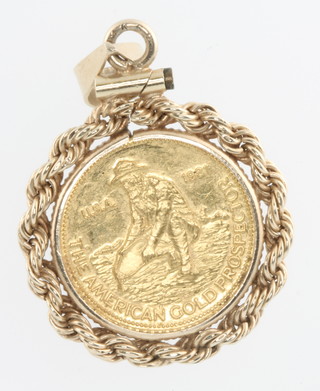 A 99.9 The American Gold Prospector commemorative coin 1981 contained in a 14ct mount, combined weight 4.8 grams 
 
