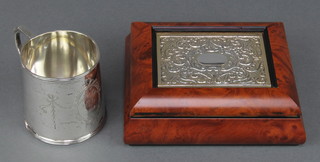 A silver mug with chased swags and ribbons Birmingham 1911 2 3/4" 114 grams and a Continental repousse silver mounted trinket box 4" 