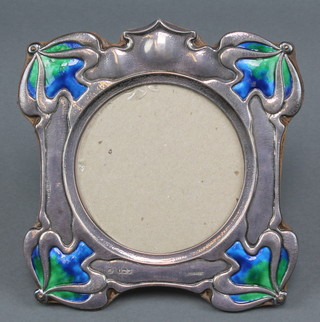 An Art Nouveau silver and enamelled photograph frame with  2 colour enamelled decoration, maker William Hutton & Sons Ltd, London 1902, 7" 