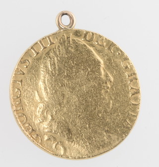A George III shield back sovereign 1782 with 9ct gold hoop