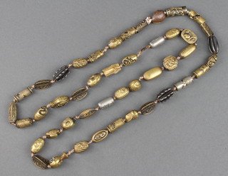A Meiji period  period string of silver, brass and copper ojimi beads, some signed 38" 