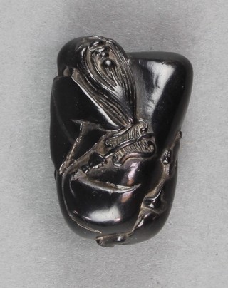 A carved hardwood Netsuke in the form of a deity 1 1/2" 