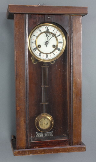 The Hamburg American Clock Co., a Vienna style striking regulator with enamelled dial and Roman numerals, grid iron pendulum, contained in a pine case 
