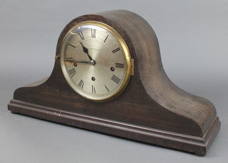 A 1930's chiming mantel clock with silvered dial and Roman numerals contained in an oak Admirals hat shaped case marked Walker & Hall, striking on gongs 