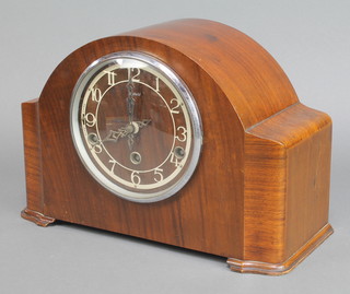 Enfield, a 1930's Art Deco 8 day chiming mantel clock with Arabic numerals contained in an arched walnut case 
