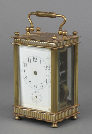 A 19th Century French 8 day carriage alarm timepiece with enamelled dial, Arabic numerals and alarm dial contained in a gilt metal case  4" x 2" x 2" 