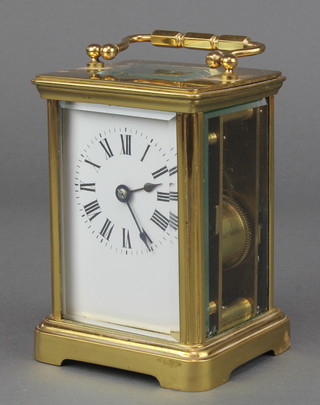 A 19th Century French 8 day striking carriage clock with enamelled dial and Roman numerals, the back plate marked Harrods Ltd SW Made in France 5"h x 3 1/2"w x 3"d 
