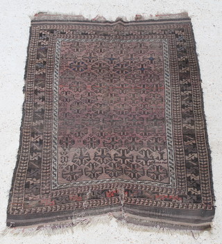 A Belouche rug with all over geometric design 49" x 35", in wear
