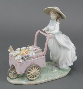 A Lladro figure of a girl with barrow of flowers and kittens no. 6141 8" 