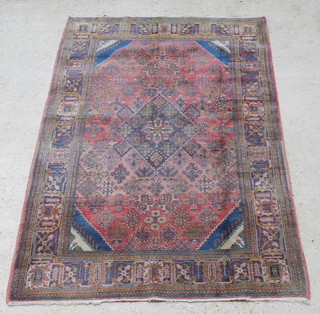 A red and blue ground Persian Josheghan rug with central medallion 84" x 63 1/2" 