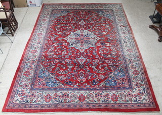 A red ground Persian Sarough carpet with central medallion 167" x 116 1/2" 