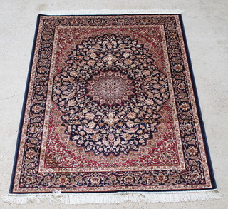 A Belgian cotton blue ground Keshan style rug with central medallion 74" x 53" 