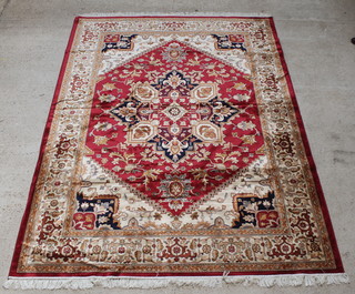 A red and gold ground Belgian cotton Heriz style rug with central medallion 110" x 80" 