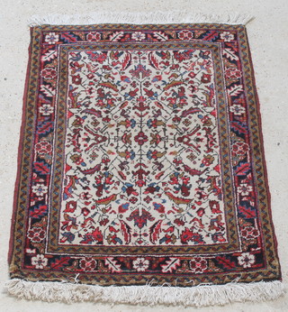 A Persian white and floral ground Brojerd rug 49" x 37" 