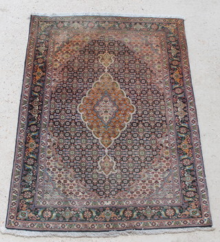 A green ground Turkoman Tabriz rug with central medallion 58" x 39" 