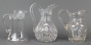 A 19th Century cut glass jug with hobnail decoration 9", a baluster ditto 8" and a tapered jug 7" 