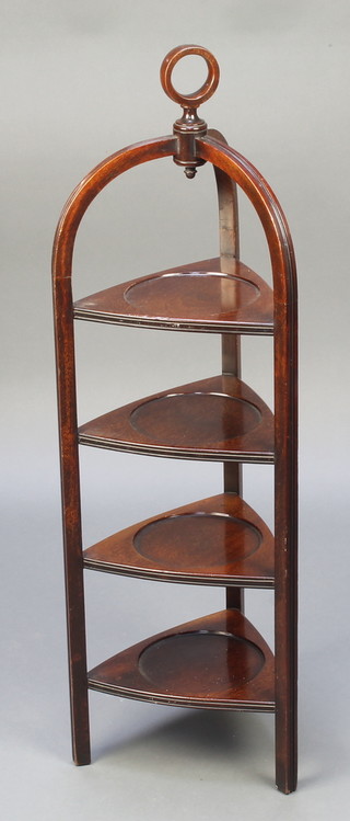 An Edwardian triangular mahogany 4 tier cake stand with ring shaped handle 37"h x 10 1/2"w x 11 1/2"d 