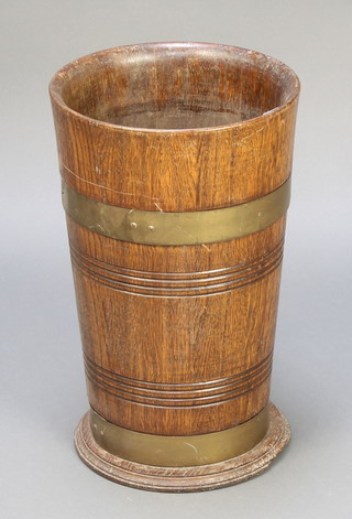 A circular coopered oak stick stand 17"h x 10 1/2" diam. 