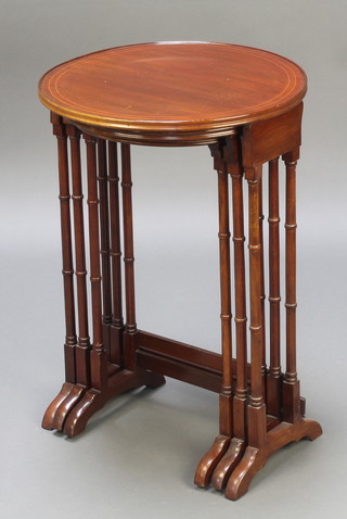 A nest of 3 Edwardian circular inlaid mahogany coffee tables raised on turned supports 26"h x 17" diam., 25"h x 15"d, 24" x 13" 
