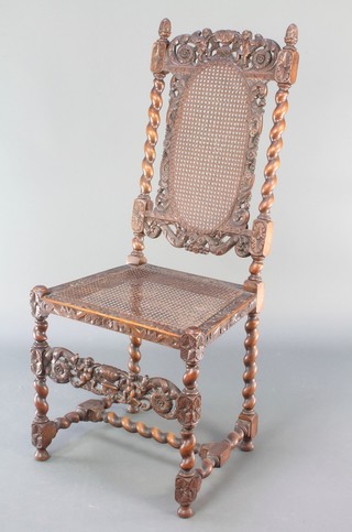 A Victorian carved walnut Carolean style high back chair with carved cresting rail decorated cherubs and spiral turned column decoration with cane seat and back, raised on spiral turned and block supports 