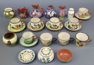 A collection of Torquay ware including tea cups and saucers, minor vases etc 