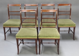 A set of 6 Victorian mahogany bar back salon chairs with bobbin turned decoration and upholstered seats raised on turned supports with H framed stretcher 