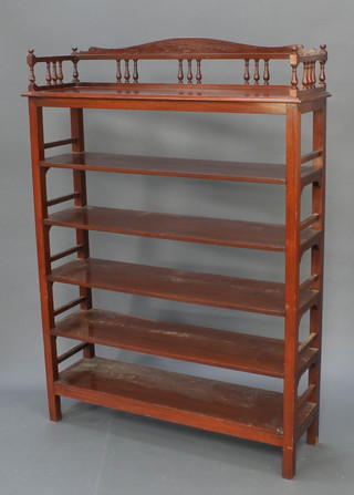 A mahogany 6 tier open bookcase the top with three-quarter gallery 60"h x 44"w x 13 1/2"d 