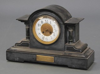A mantel clock, the porcelain dial with Arabic numerals contained in a grey slate case 
